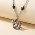 Sourpuss "Good Luck” Horseshoe Necklace with Red Rhinestones & Black Star Charms